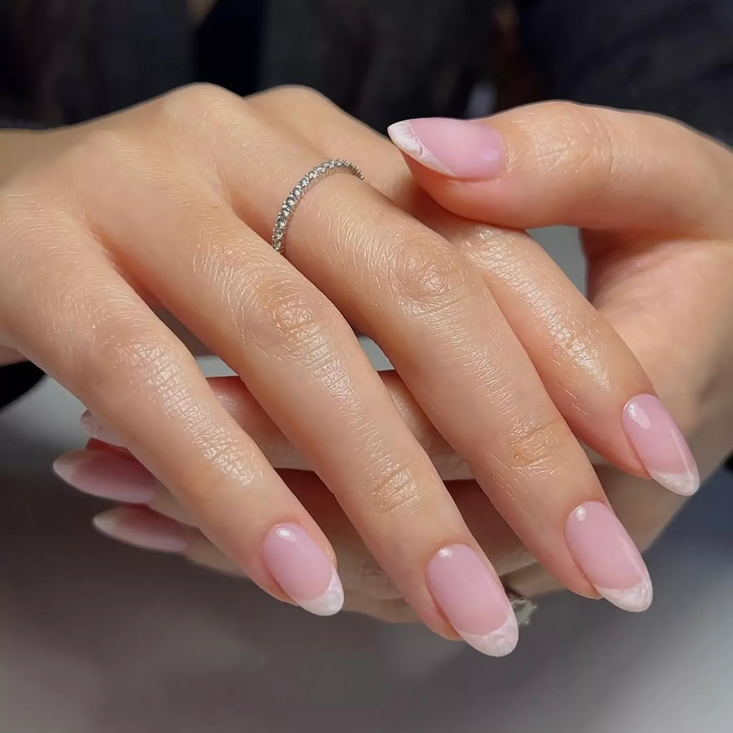 a strawberry milk manicure with pearly french tips