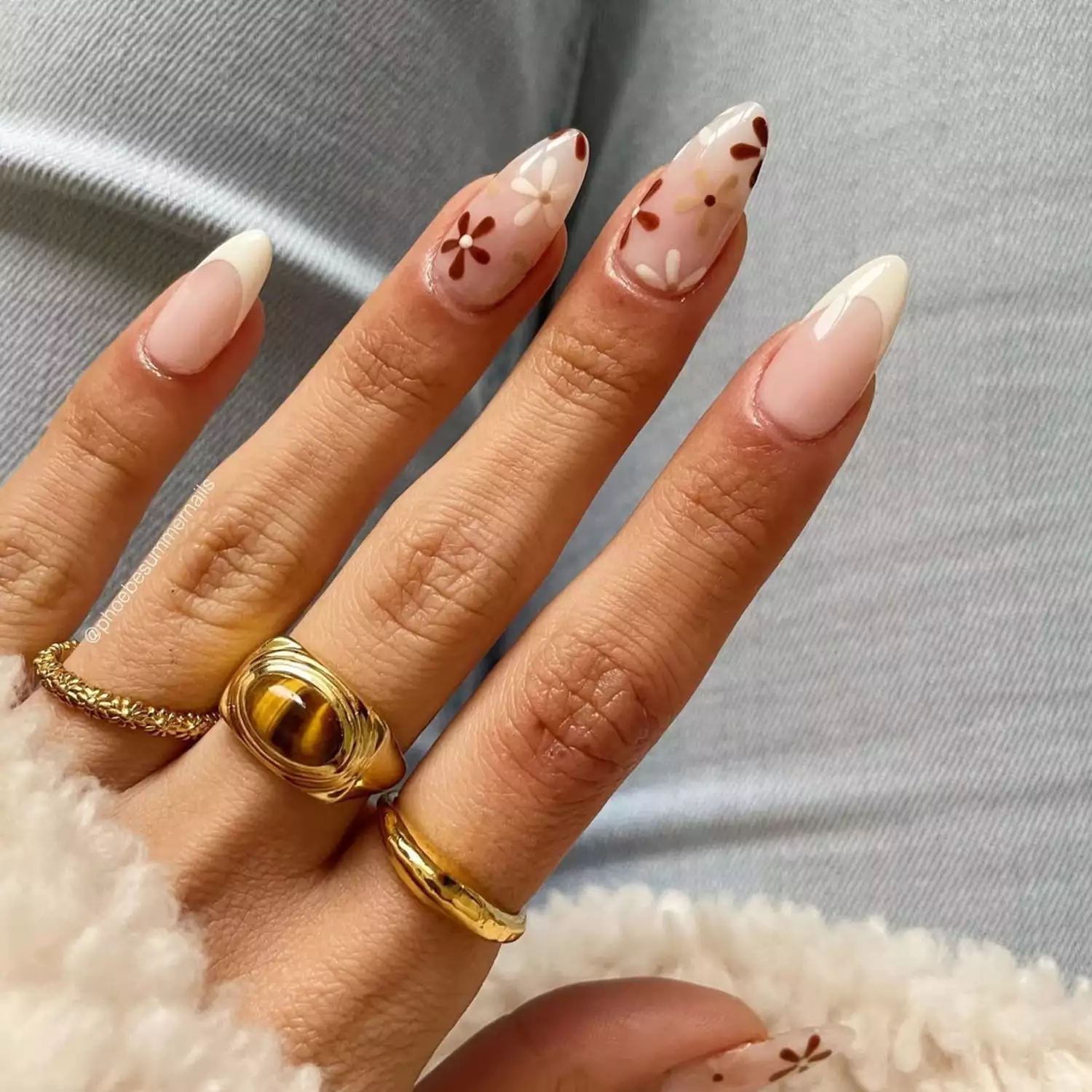 Cream French manicure with neutral-colored floral designs