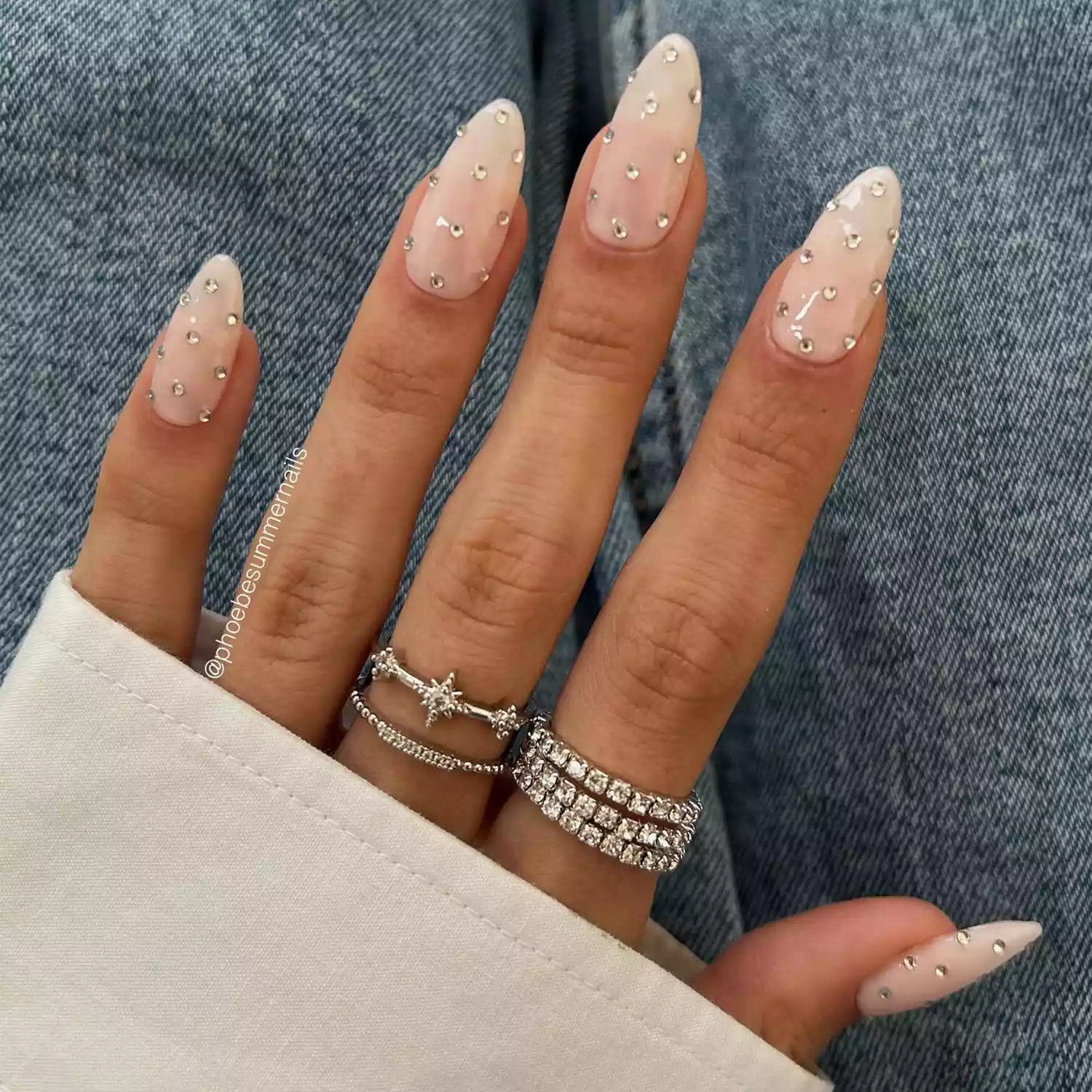 Milky manicure with silver rhinestones