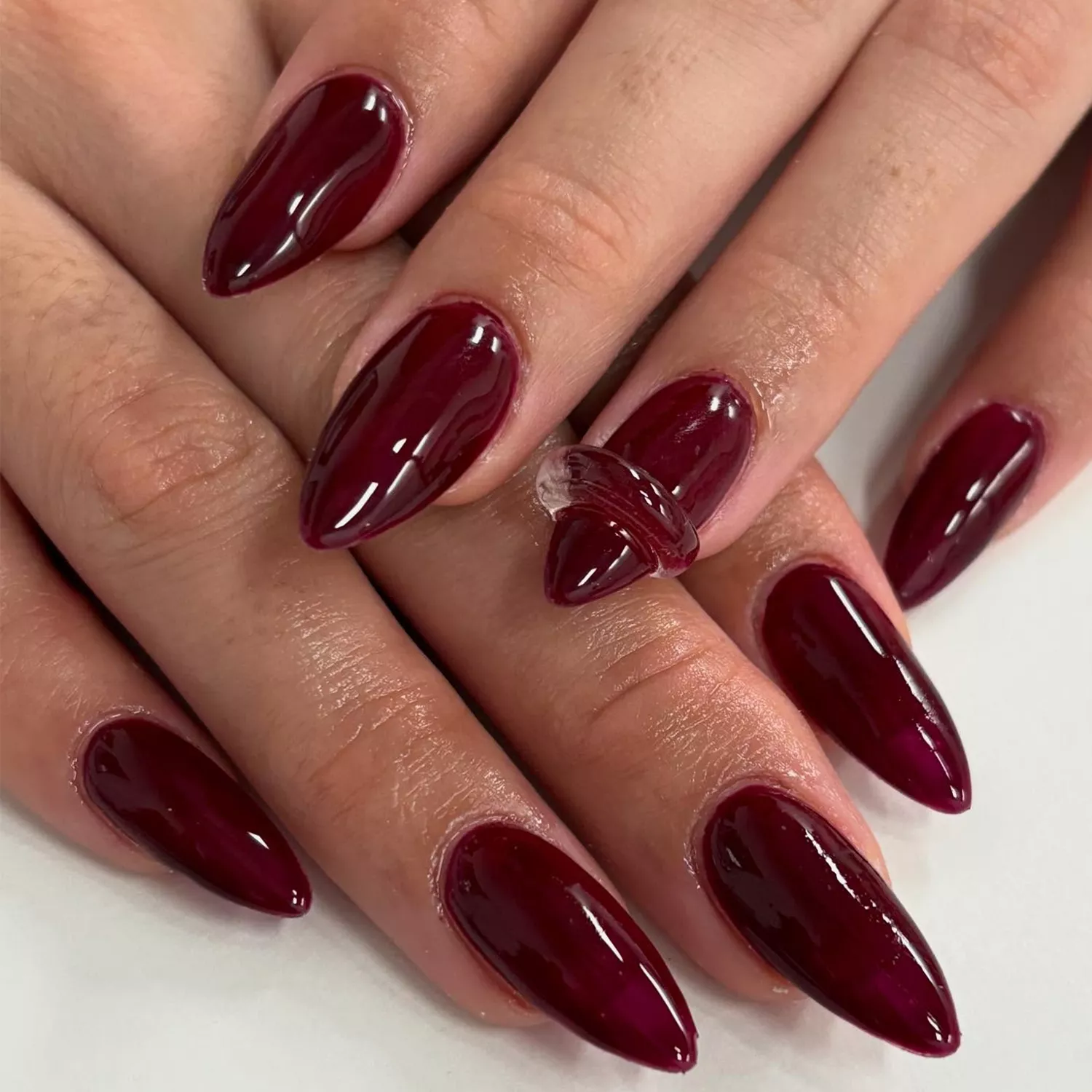 short red coffin nails with clear builder gel accents