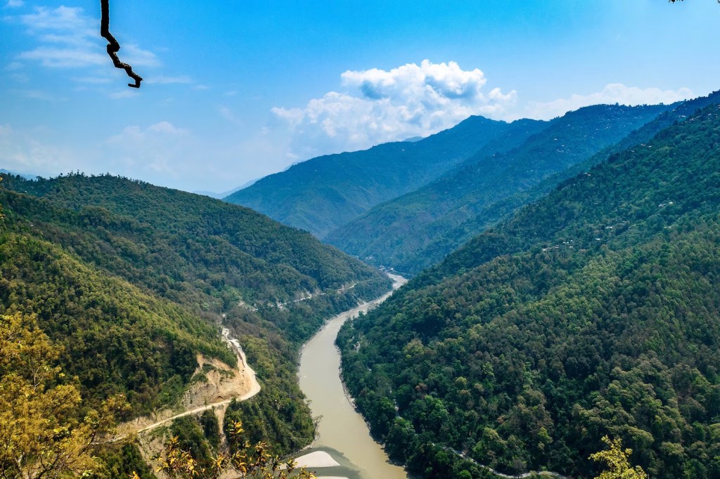 Rangeet River meeting Teesta River in a valley with Himalayan Mountains in the background