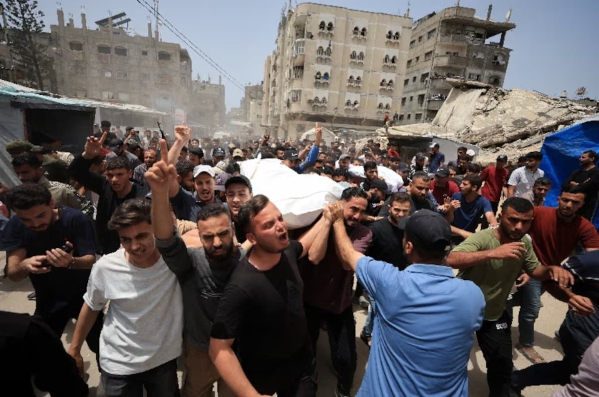 Mourners carry the bodies of Palestinians who were killed in an Israeli strike, according to medics, in Gaza City, May 17, 2026. REUTERS