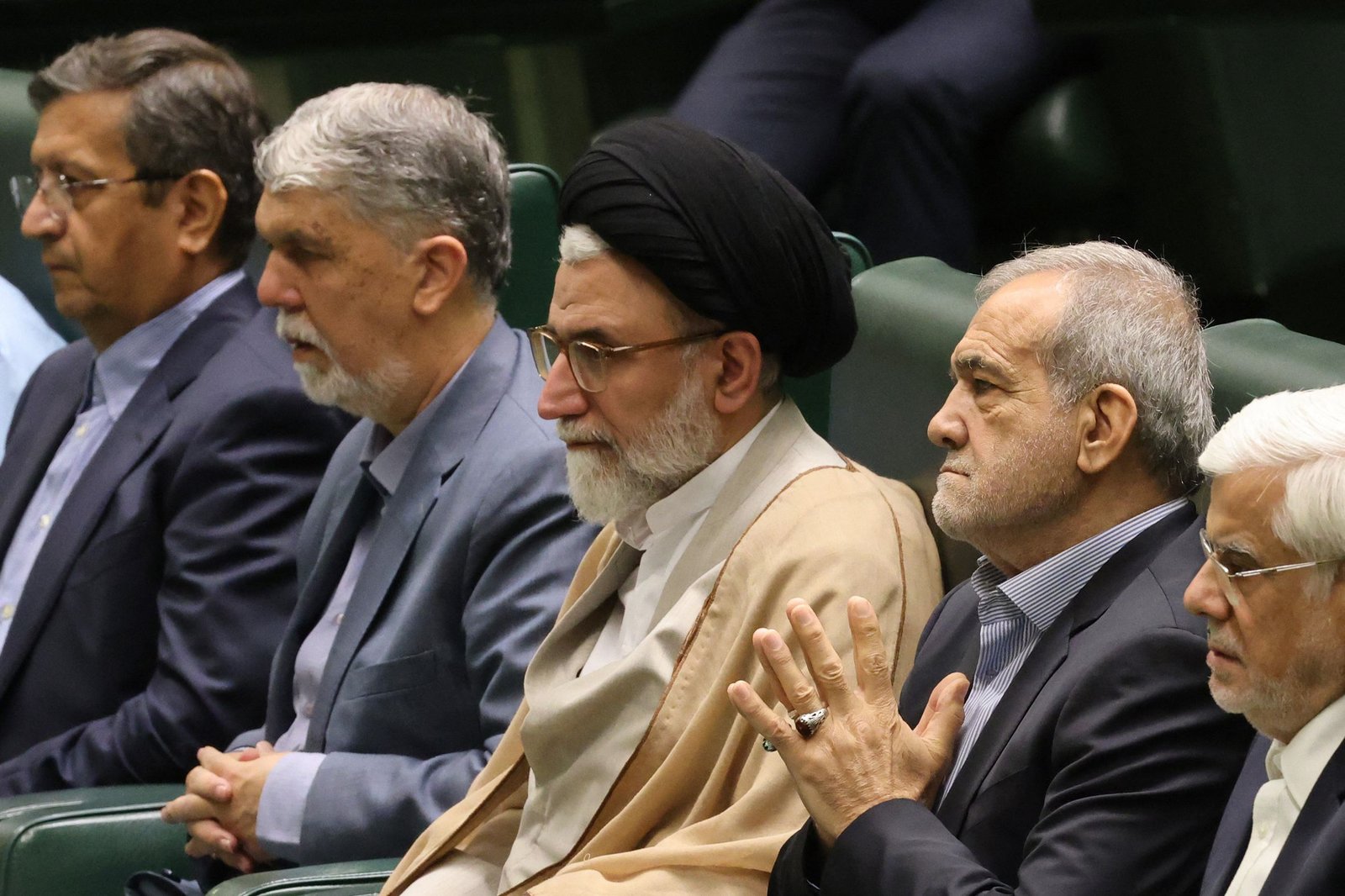 Iran's Minister of Intelligence Esmail Khatib sits with Iran's President Masoud Pezeshkian before a speech to defend his cabinet selection to members of parliament in the capital Tehran on August 17, 2024. PHOTO FILE: AFP