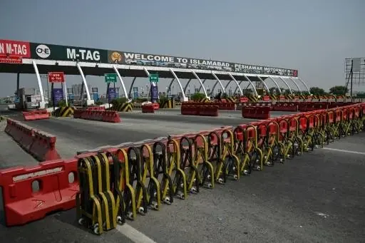 A general view shows the Islamabad–Peshawar Motorway blocked with trucks placed by authorities in Islamabad on September 24, 2026, ahead of PTI protest demanding the release of founder Imran Khan .