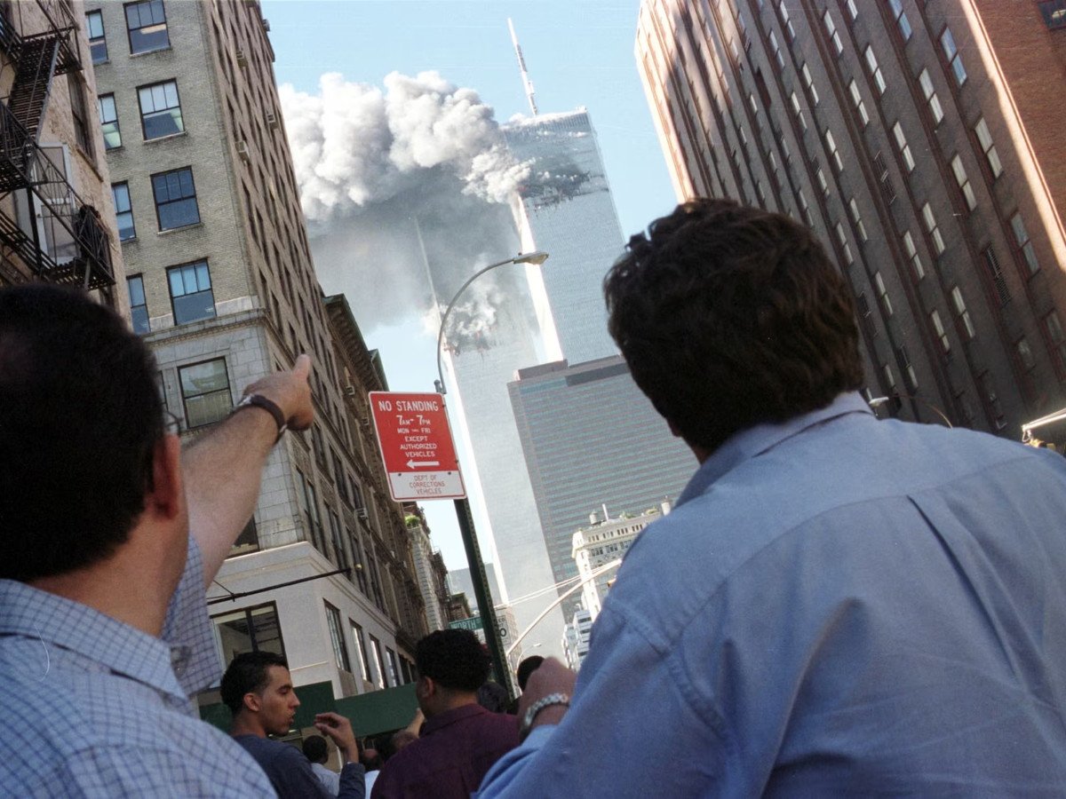 Pedestrians react to the World Trade Centre collapse, September 11, 2001. Photo: Reuters/ File